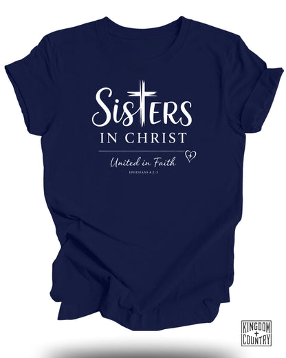 Navy t-shirt with "SISTERS" and "United in Faith Ephesians 4:2-3" text.
