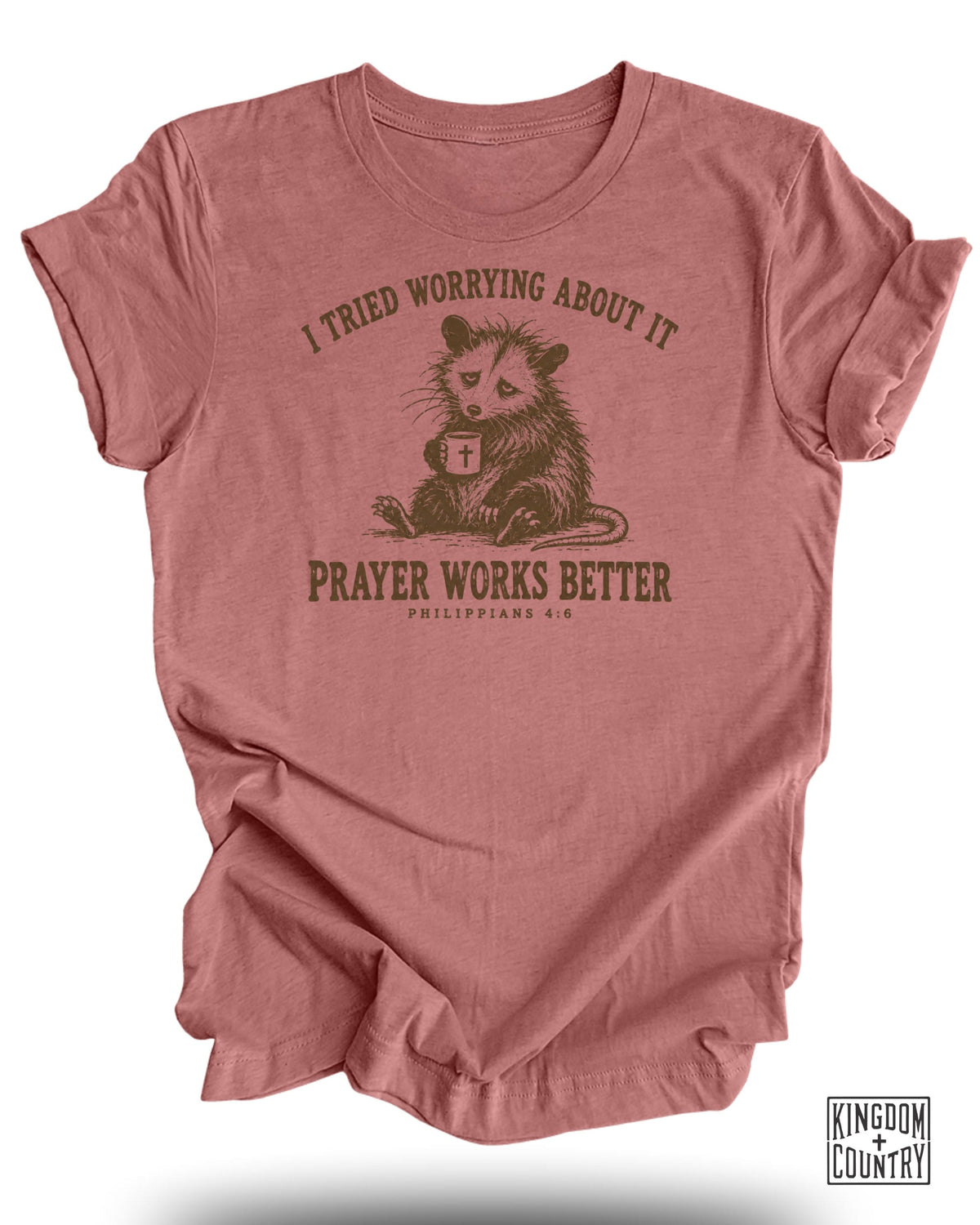 T-shirt with opossum holding mug and text "I tried worrying about it. Prayer works better."