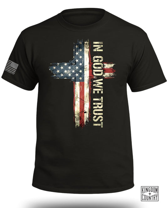 Black t-shirt with distressed American flag cross and "IN GOD WE TRUST" text.