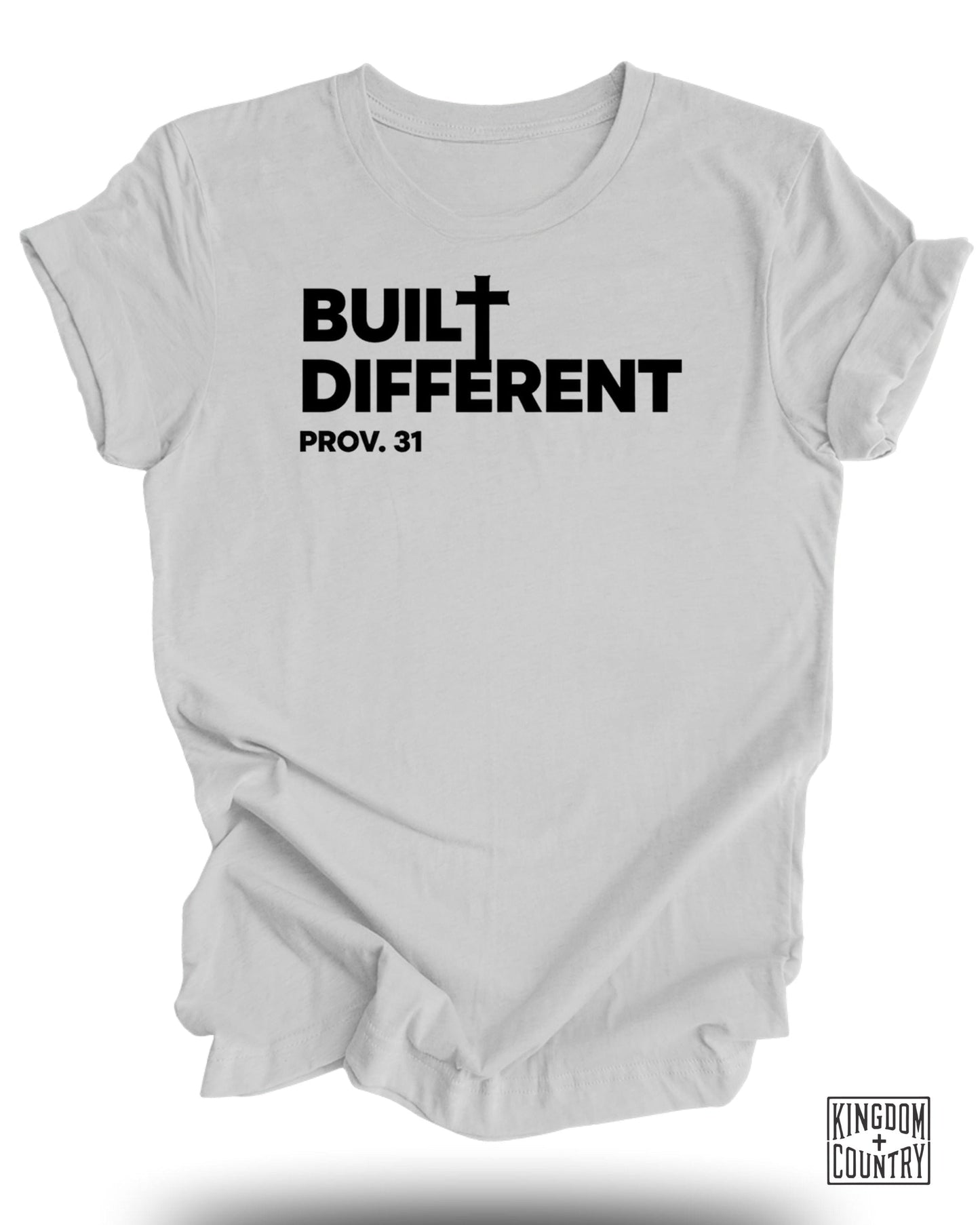 White t-shirt with black text "BUILT DIFFERENT PROV. 31" and a small logo.