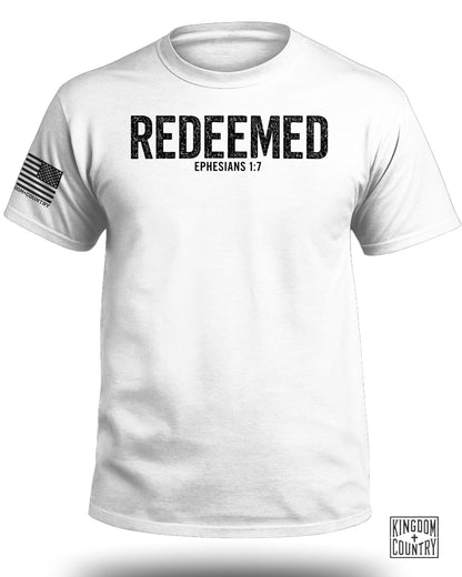 White t-shirt with "REDEEMED" and "EPHESIANS 1:7" text.