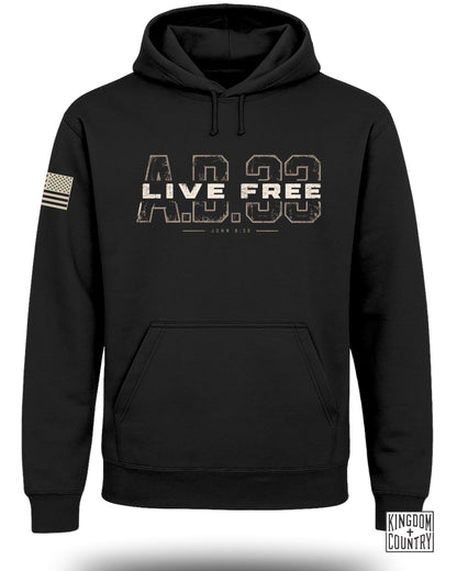 A black hooded sweatshirt featuring a distressed graphic with the text LIVE FREE AD 33.