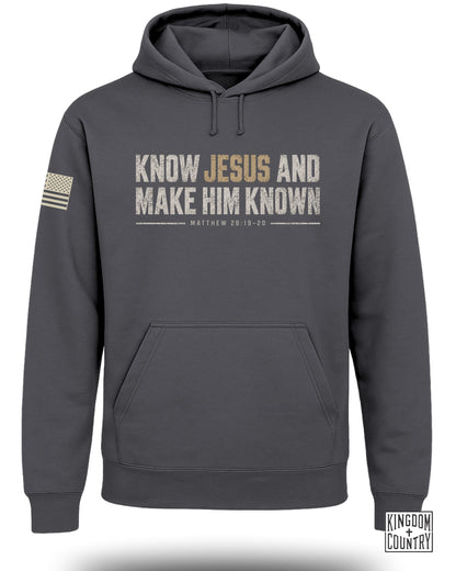 Dark gray hoodie with "Know Jesus and Make Him Known" text and US flag patch.