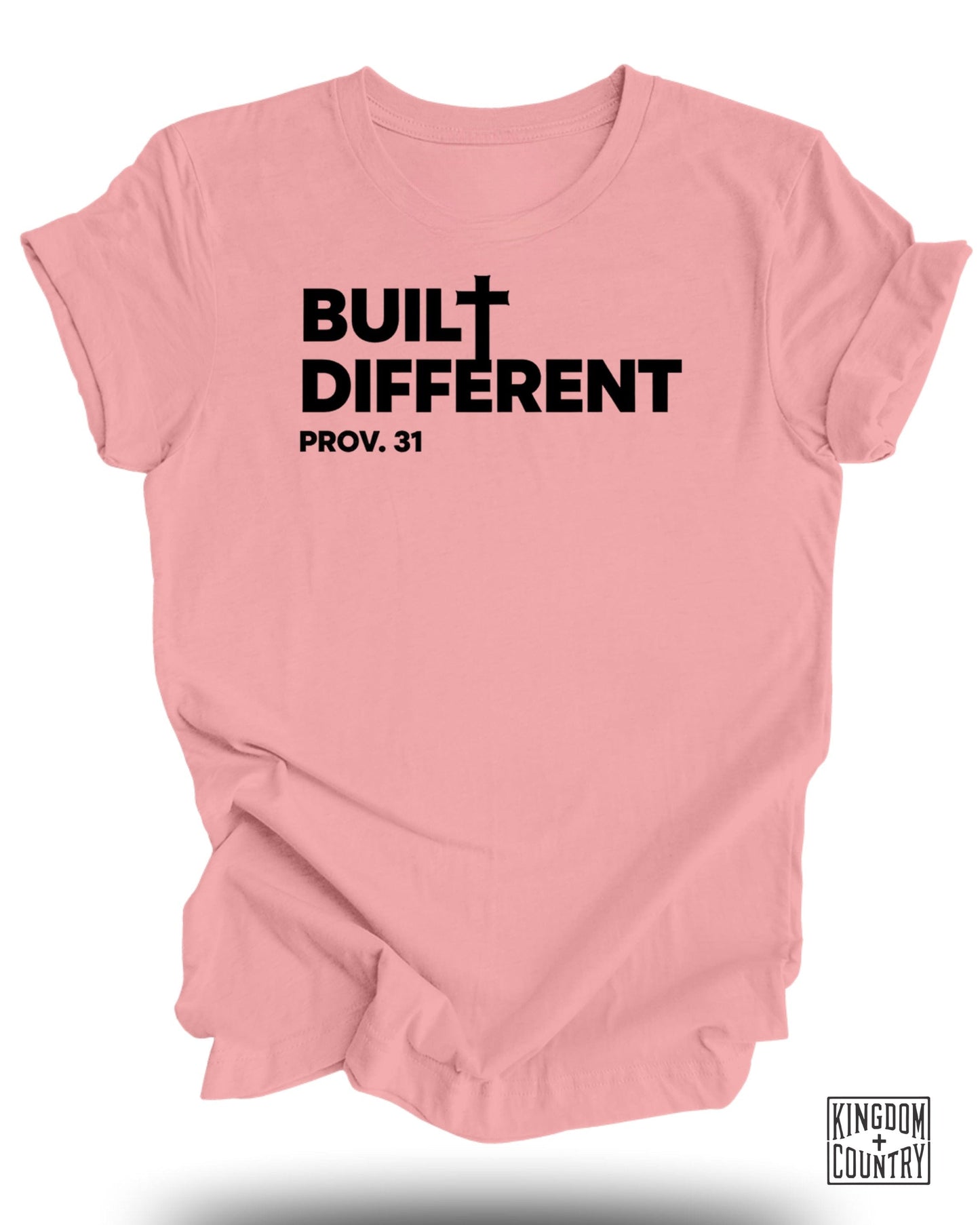 Pink t-shirt with "BUILT DIFFERENT PROV. 31" and Kingdom Country logo.