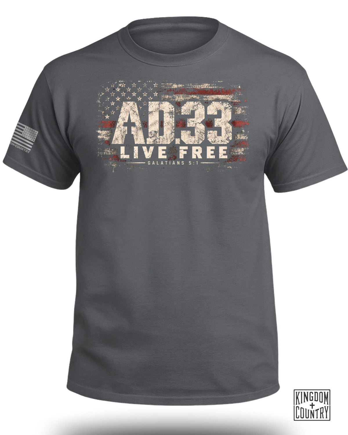 Charcoal grey short-sleeve crewneck t-shirt featuring a distressed American flag graphic with the text AD33, LIVE FREE, and Galatians 5:1.