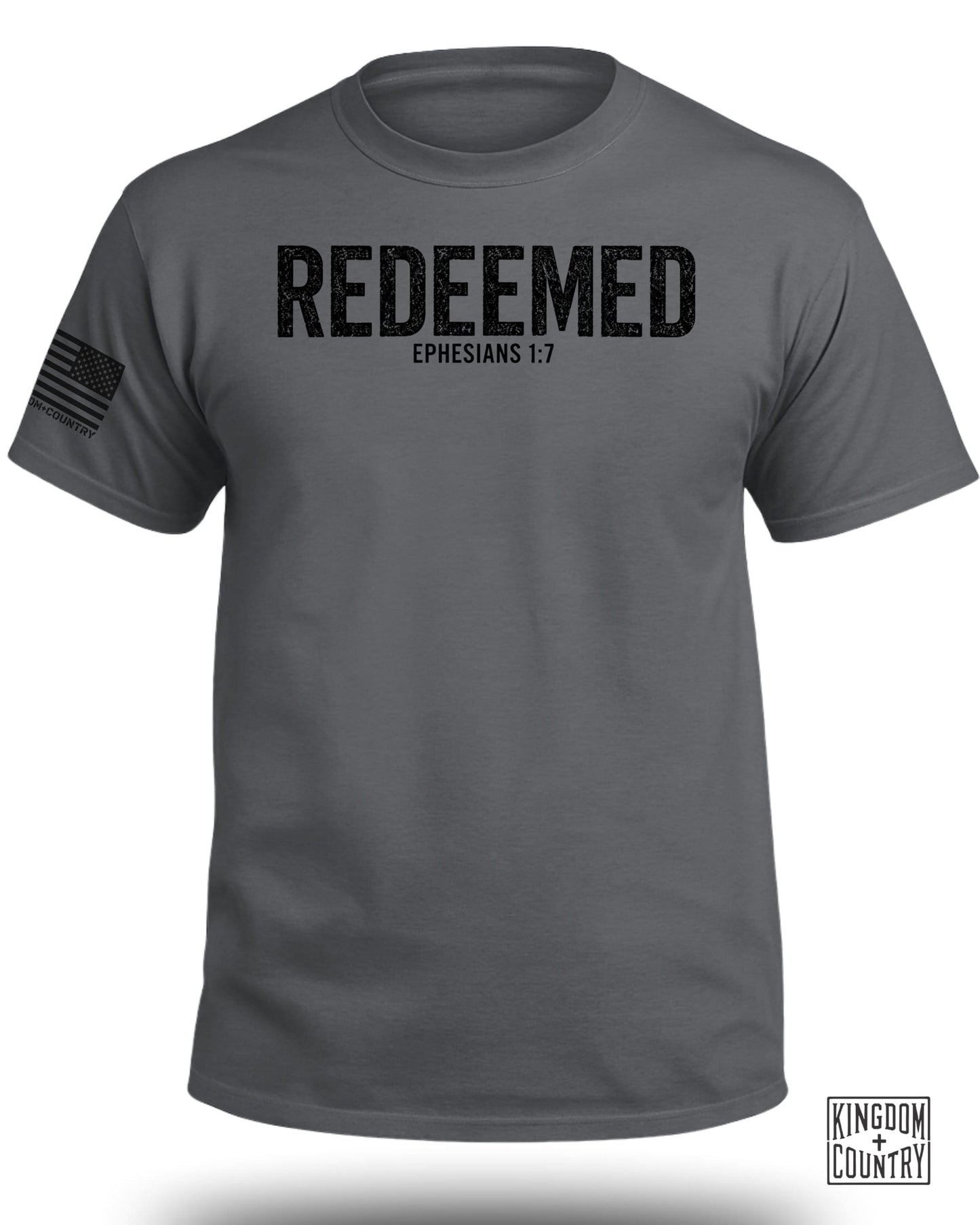 Dark grey t-shirt with black distressed text "REDEEMED EPHESIANS 1:7" and U.S. flag graphic.