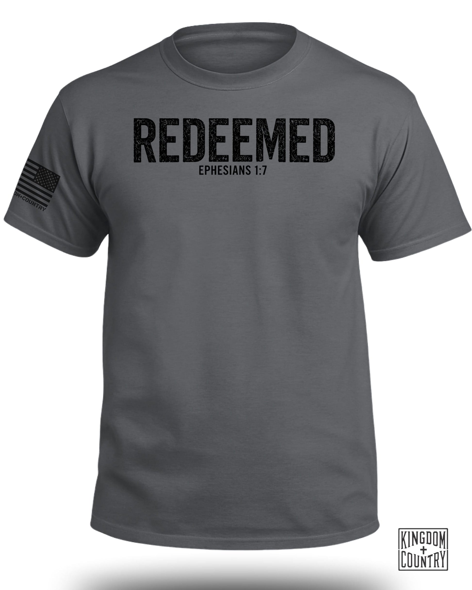 Dark grey t-shirt with black distressed text "REDEEMED EPHESIANS 1:7" and U.S. flag graphic.