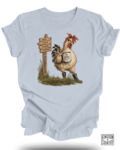 A chicken wearing a bandana and boots holds a mug with "His Grace Fuels Me".