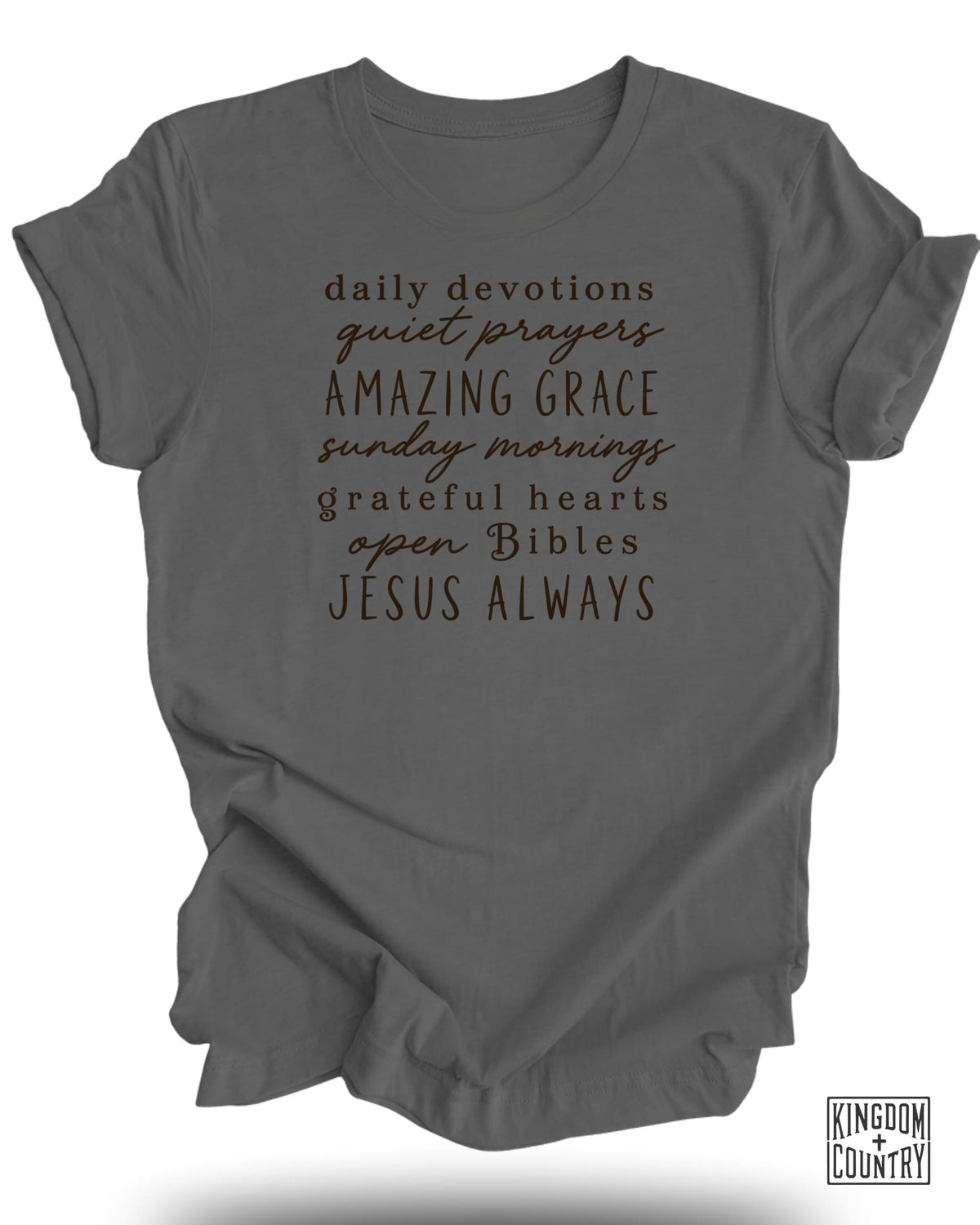 Gray t-shirt with "Daily Devotions Quiet Prayers Amazing Grace Sunday Mornings Grateful Hearts Open Bibles Jesus Always" text.