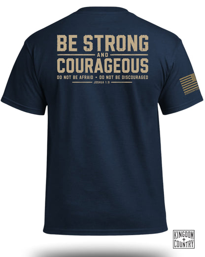 Navy t-shirt with "BE STRONG AND COURAGEOUS, DO NOT BE AFRAID, DO NOT BE DISCOURAGED JOSHUA 1:9" text.