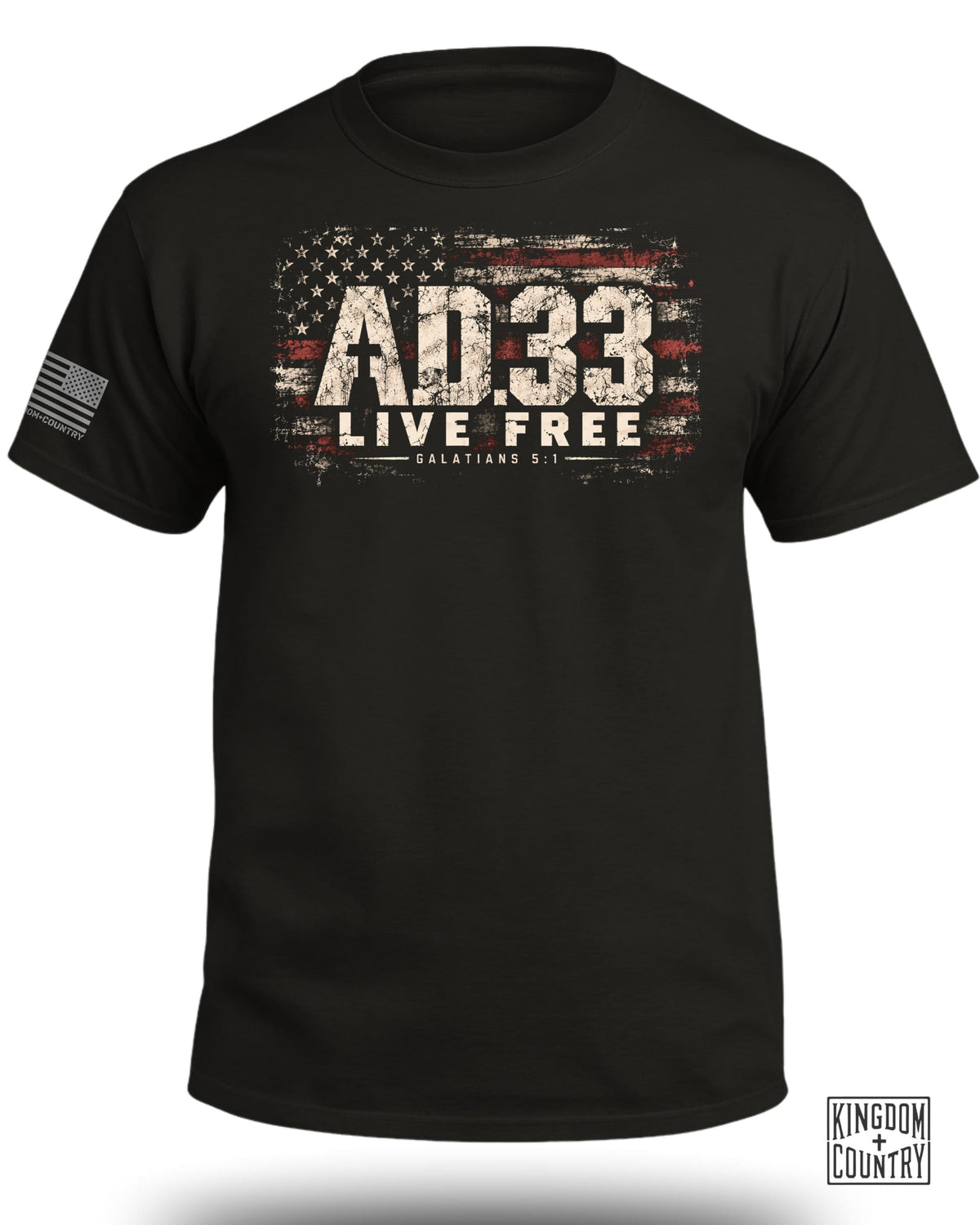 A black crewneck t-shirt featuring a distressed American flag graphic, text reading AD.33 LIVE FREE GALATIANS 5:1, and a sleeve flag.