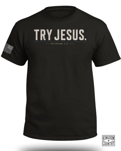 Black t-shirt with "TRY JESUS. PHILIPPIANS 4:13" text and American flag logo.