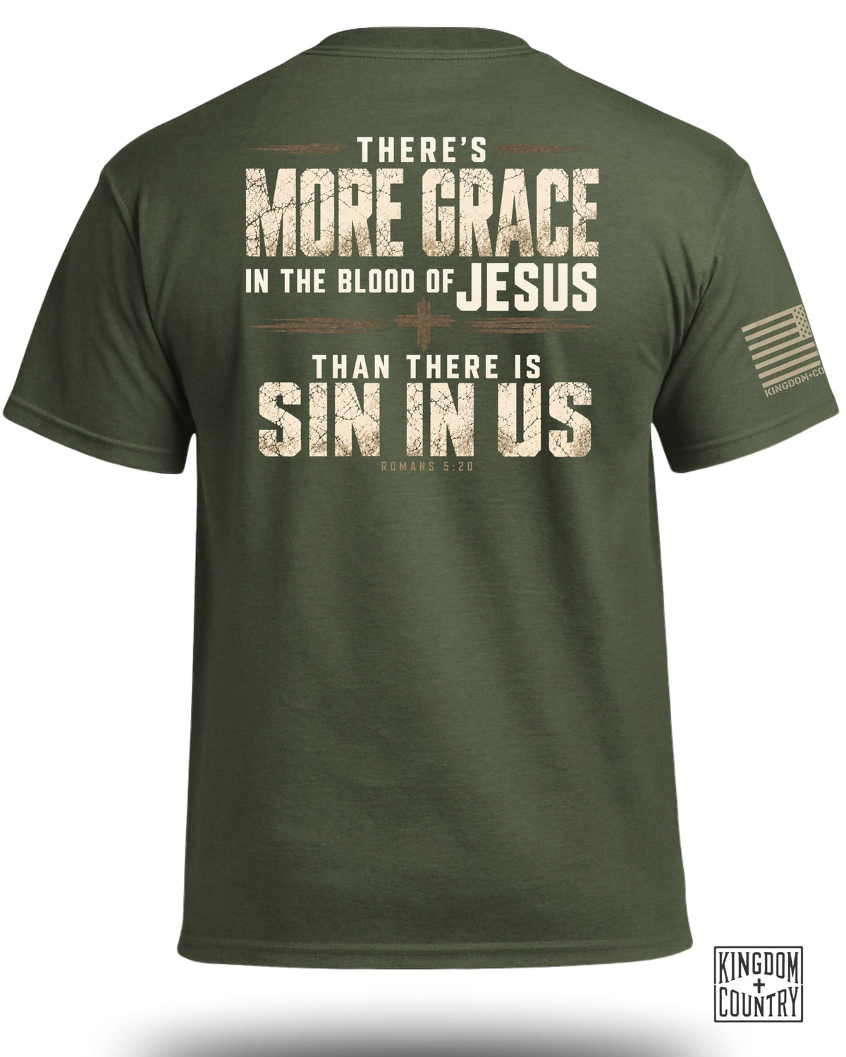 Olive green crewneck t-shirt viewed from the back, featuring distressed religious text and a small flag on the sleeve.