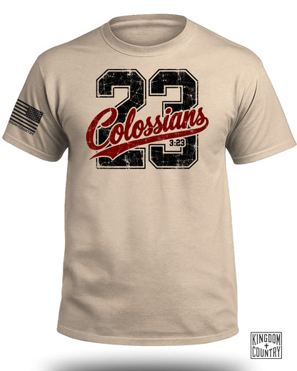 Tan t-shirt with distressed "23 Colossians 3:23" graphic and American flag patch.
